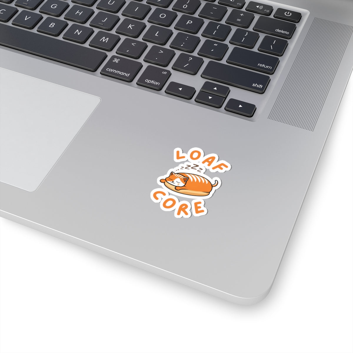 2x2 white cute loaf cat sticker with orange eepy cat design on a laptop