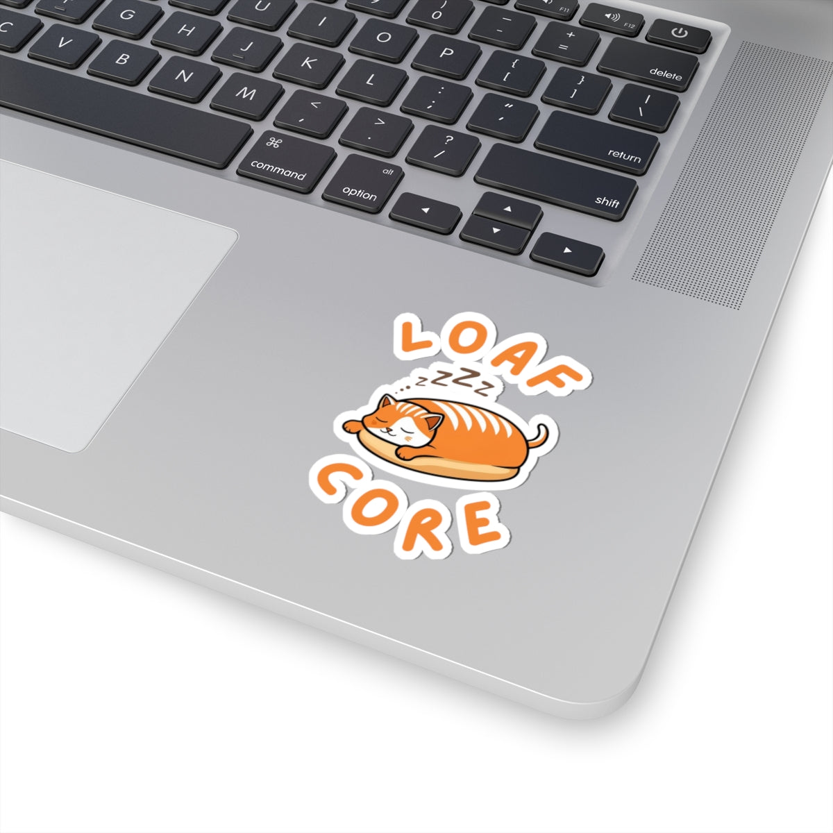3x3 white cute loaf cat sticker with orange eepy cat design on a laptop