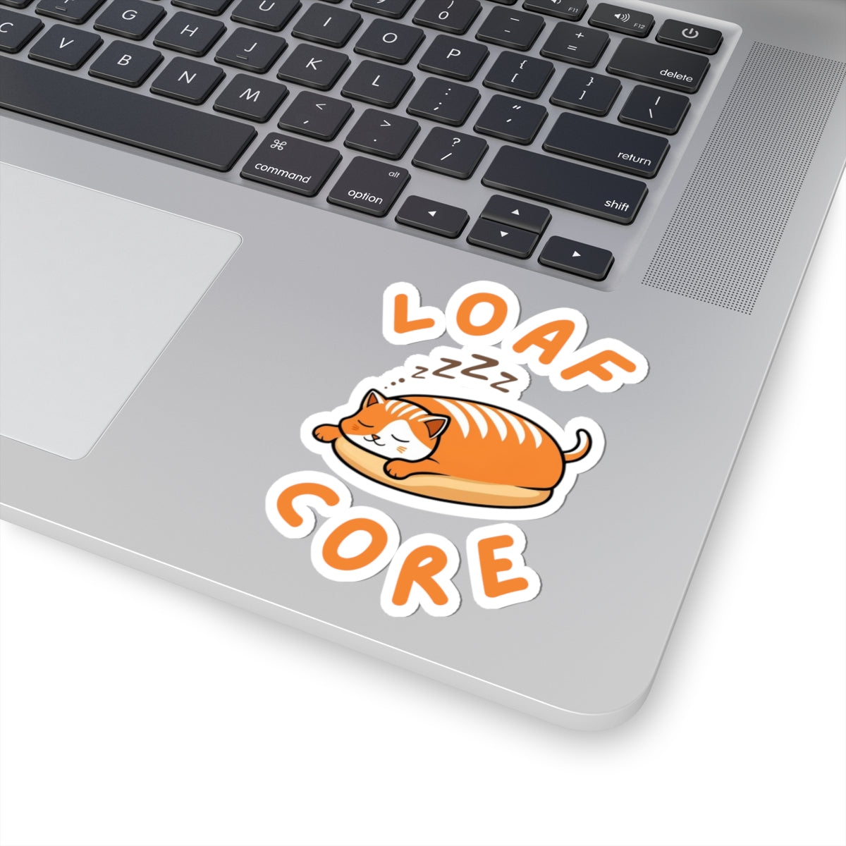 4x4 white cute loaf cat sticker with orange eepy cat design on a laptop