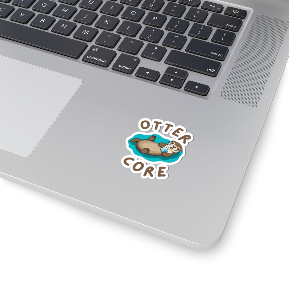 2x2 white Otter Core sea otter sticker on laptop – cute vinyl animal sticker