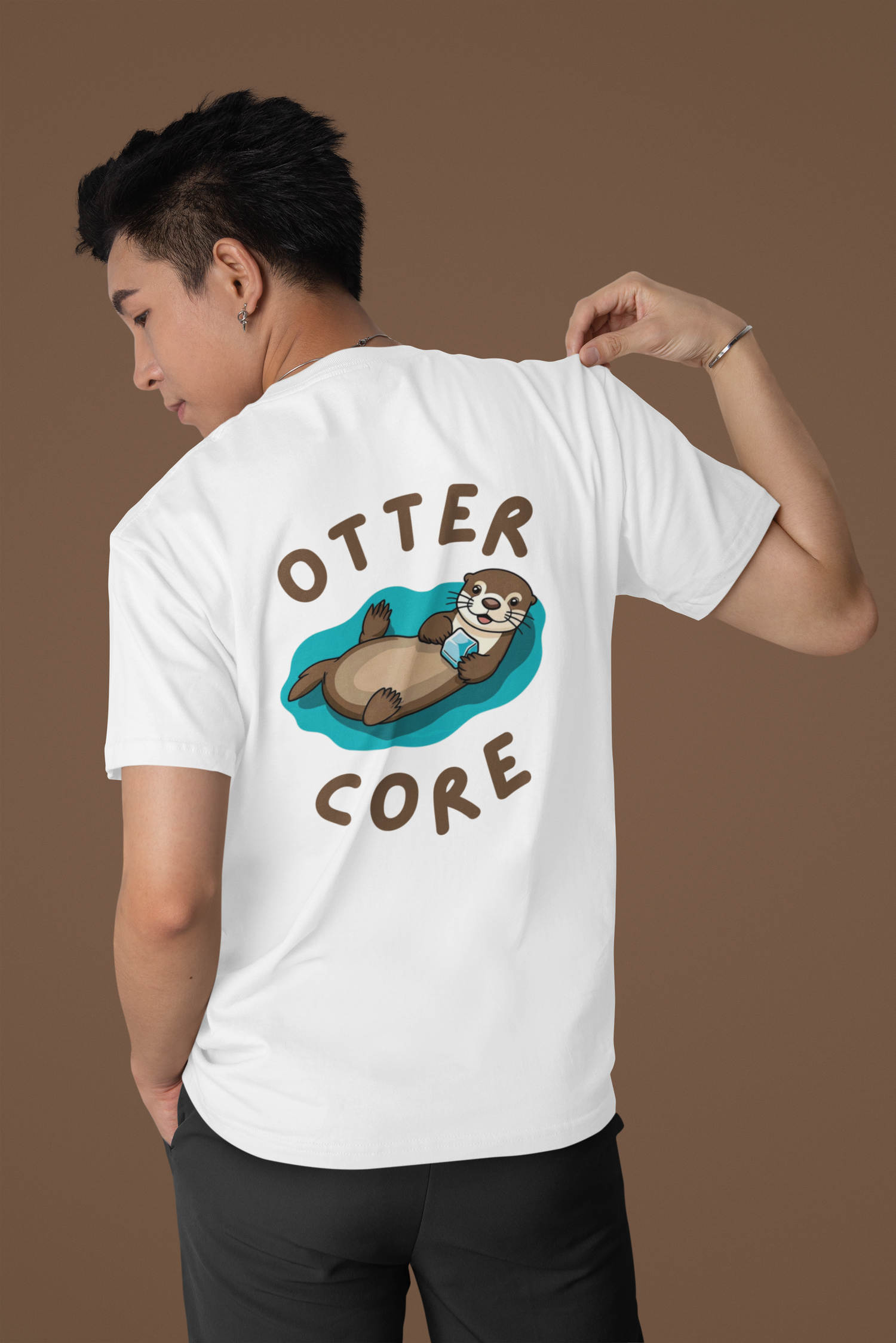 Lifestyle mockup of Otter Core t-shirt with cute sea otter design – animal lover shirt